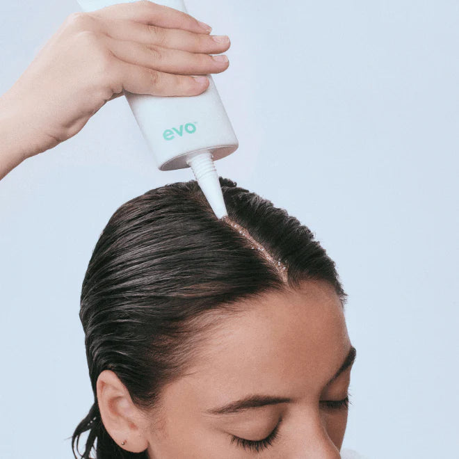 woman applying scalp care